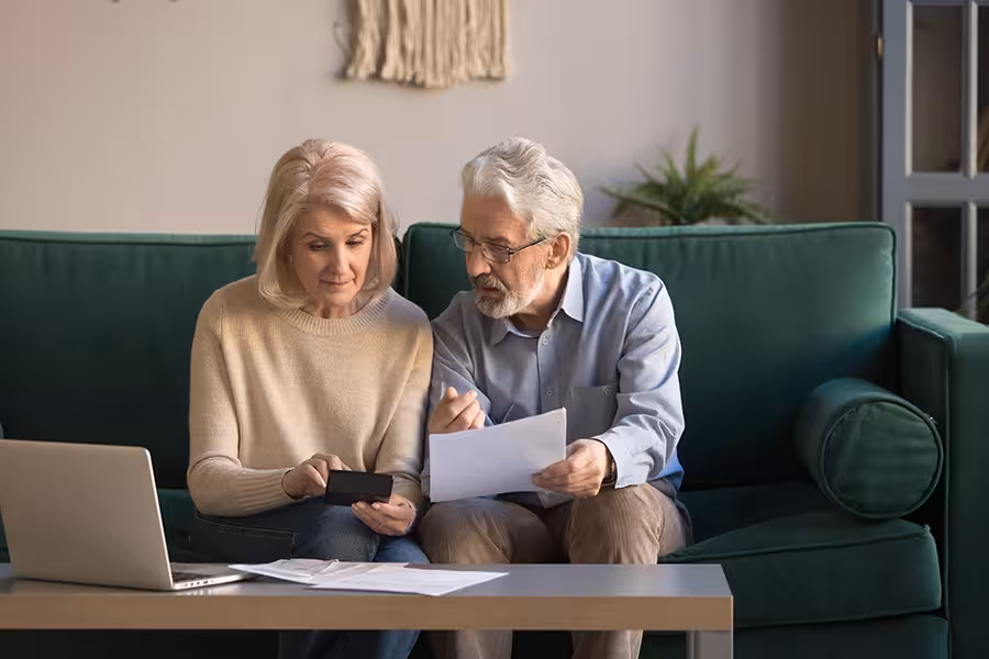 Over 65s reviewing the cost of their health insurance